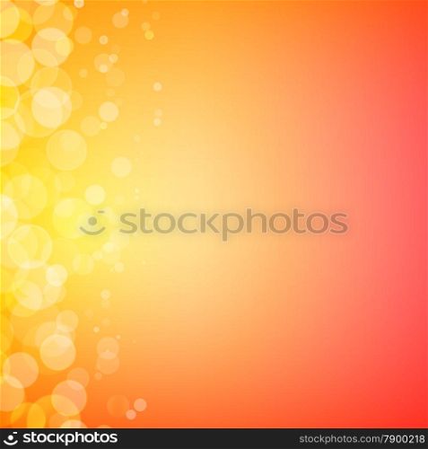 Abstract bokeh sparkles on sunny orange blurred background