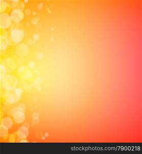 Abstract bokeh sparkles on sunny orange blurred background