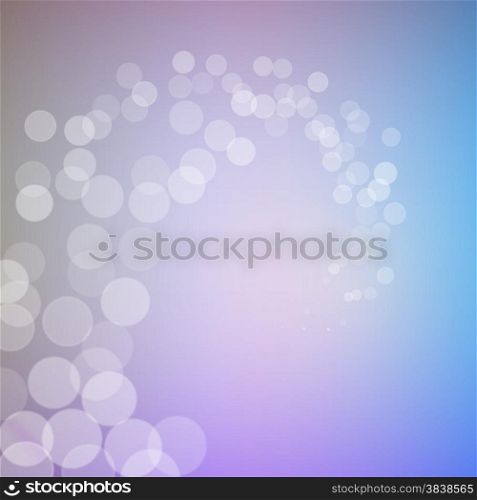 Abstract bokeh sparkles swirl on blue blurred background