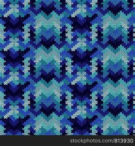Abstract knitted seamless ornamental pattern in blue and turquoise hues on the mute background, vector as a fabric texture