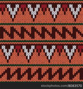 Abstract knitting ornamental seamless ethnic vector pattern with geometric color figures as a knitted fabric texture in warm colors