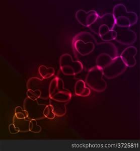 Abstract red and pink glowing heart shaped lights.
