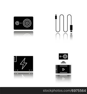 Action camera drop shadow black icons set. Mini USB cable, battery, action camera to smartphone wireless connection. Isolated vector illustrations. Action camera drop shadow black icons set