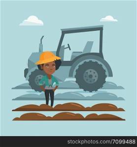 African-american farmer in summer hat standing on the background of tractor preparing land. Young smiling farmer standing in a field in front of tractor. Vector cartoon illustration. Square layout.. Farmer standing on the background of tractor.