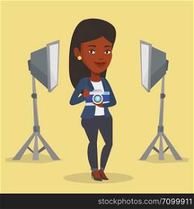 African-american photographer holding a camera in photo studio. Photographer using professional camera in the studio. Young photographer taking a photo. Vector flat design illustration. Square layout.. Photographer with camera in photo studio.