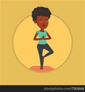 African-american sportswoman meditating in yoga tree position. Sportswoman standing in yoga tree pose. Woman doing yoga on the mat. Vector flat design illustration in the circle isolated on background. Young woman practicing yoga tree pose.
