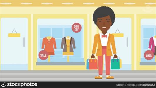African-american woman holding shopping bags on the background of boutique window with dressed mannequins. Happy young woman carrying shopping bags. Vector flat design illustration. Horizontal layout.. Happy woman with bags vector illustration.