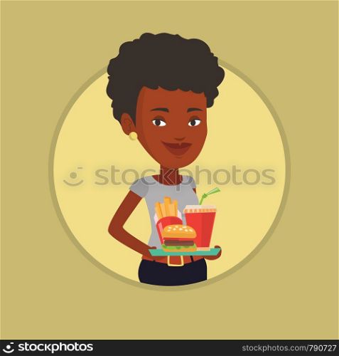 African-american woman holding tray with fast food. Woman having a lunch in a fast food restaurant. Happy woman with fast food. Vector flat design illustration in the circle isolated on background.. Woman holding tray full of fast food.