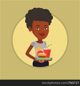 African-american woman holding tray with fast food. Woman having a lunch in a fast food restaurant. Happy woman with fast food. Vector flat design illustration in the circle isolated on background.. Woman holding tray full of fast food.