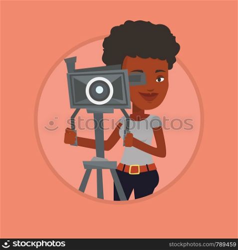 African cameraman looking through movie camera on a tripod. Cameraman with professional video camera. Cameraman taking a video. Vector flat design illustration in the circle isolated on background.. Cameraman with movie camera on tripod.