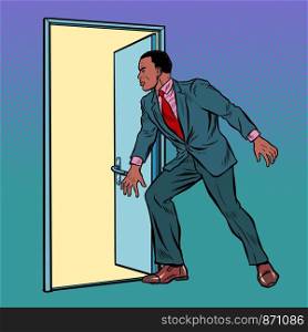 African man opens the door. Pop art retro vector illustration drawing. African man opens the door