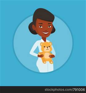 African pediatrician in medical gown. Pediatrician doctor holding a teddy bear. Pediatrician doctor standing with a teddy bear. Vector flat design illustration in the circle isolated on background.. Pediatrician doctor holding teddy bear.