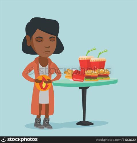 African sad woman standing near the table with fast food and having a stomach ache from heartburn. Young woman suffering from a heartburn after fast food. Vector cartoon illustration. Square layout.. Young african sad woman suffering from heartburn.