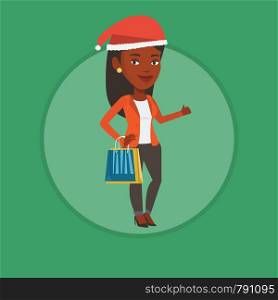 African woman carrying shopping bags. Woman in santa hat holding shopping bags and giving thumb up. Woman buying christmas gifts. Vector flat design illustration in the circle isolated on background. Woman in santa hat shopping for christmas gifts.