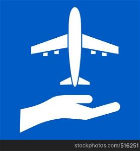 Airplane and palm icon white isolated on blue background vector illustration. Airplane and palm icon white