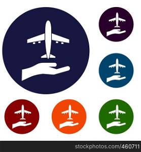 Airplane and palm icons set in flat circle reb, blue and green color for web. Airplane and palm icons set