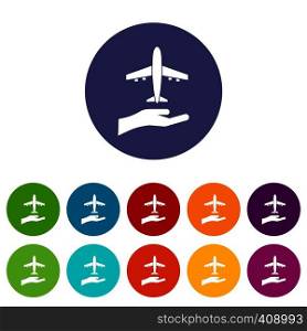 Airplane and palm set icons in different colors isolated on white background. Airplane and palm set icons
