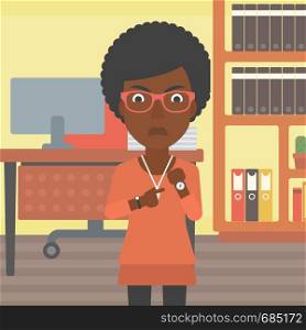 An african-american angry business woman standing in the office and pointing at her wrist watch. Vector flat design illustration. Square layout.. Angry business woman pointing at wrist watch.