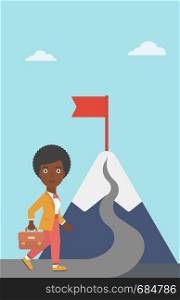 An african-american business woman standing at the foot of the mountain. Business woman walking on road leading to flag on the top of the mountain. Vector flat design illustration. Vertical layout.. Leader business woman vector illustration.