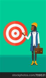 An african-american business woman standing with arrow in hand and aiming at a target board on a green background vector flat design illustration. Vertical layout.. Business woman with target board.