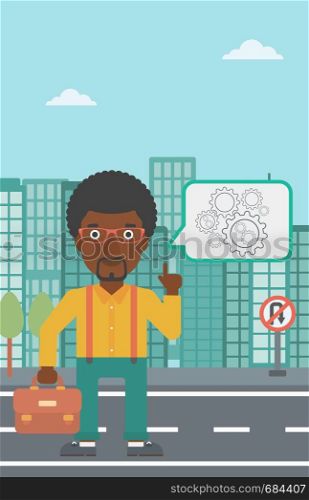An african-american businessman pointing his forefinger at cogwheels on a city background. Vector flat design illustration. Vertical layout.. Businessman pointing at cogwheels.