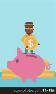 An african-american businessman saving money by putting a coin in a big piggy bank on a background of stacks of gold coins. Vector flat design illustration. Vertical layout.. Man putting coin in piggy bank vector illustration