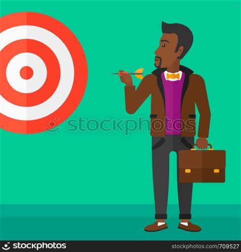 An african-american businessman standing with arrow in hand and aiming at a target board on a green background vector flat design illustration. Square layout.. Businessman with target board.