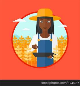 An african-american farmer in summer hat checking plants in a wheat field. Female farmer working on a digital tablet in field. Vector flat design illustration in the circle isolated on background.. Farmer with tablet computer on field.