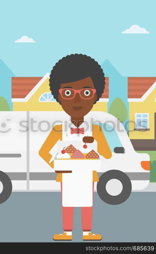 An african-american female baker holding a box of cakes. A baker delivering cakes. Baker with cupcakes standing on the background of delivery truck. Vector flat design illustration. Vertical layout.. Baker delivering cakes vector illustration.