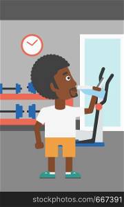 An african-american man drinking water in the gym vector flat design illustration. Vertical layout.. Man drinking water.