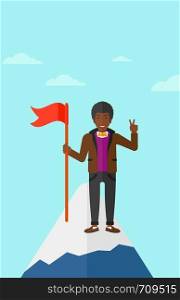 An african-american man holding a red flag on the top of the mountain on the background of blue sky vector flat design illustration. Vertical layout.. Cheerful leader man.