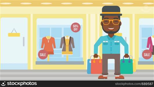 An african-american man holding shopping bags on the background of boutique window with dressed mannequins. Happy young man carrying shopping bags. Vector flat design illustration. Horizontal layout.. Happy man with shopping bags vector illustration.