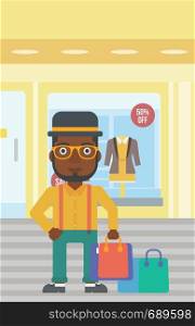 An african-american man holding shopping bags on the background of boutique window with dressed mannequins. Happy young man carrying shopping bags. Vector flat design illustration. Vertical layout.. Happy man with shopping bags vector illustration.