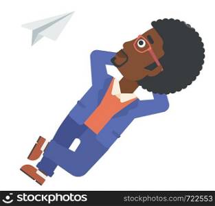 An african-american man lying on a cloud and looking at flying paper plane vector flat design illustration isolated on white background. . Businessman relaxing on cloud.