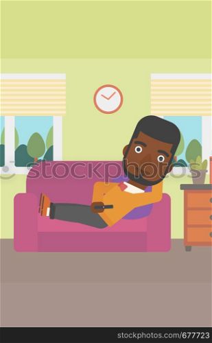 An african-american man lying on a sofa and watching tv with a remote control in his hand vector flat design illustration. Vertical layout.. Man lying on sofa.