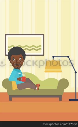 An african-american man lying on sofa in living room and holding a cup of hot flavored tea vector flat design illustration. Vertical layout.. Man lying with cup of tea.