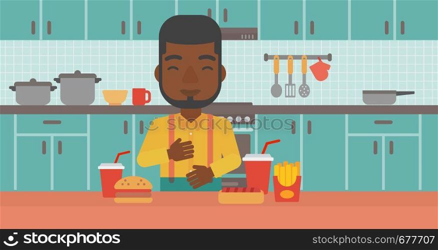 An african-american man standing in the kitchen in front of table full of junk food and suffering from heartburn vector flat design illustration. Horizontal layout.. Man suffering from heartburn.