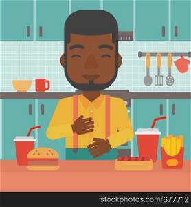 An african-american man standing in the kitchen in front of table full of junk food and suffering from heartburn vector flat design illustration. Square layout.. Man suffering from heartburn.