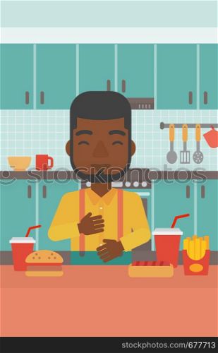 An african-american man standing in the kitchen in front of table full of junk food and suffering from heartburn vector flat design illustration. Vertical layout.. Man suffering from heartburn.