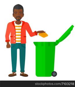 An african-american man throwing a trash into a green bin vector flat design illustration isolated on white background. . Man throwing trash.