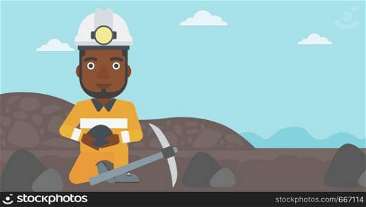 An african-american miner in hard hat sitting with coal in hands and a pickaxe on the background of coal mine. Vector flat design illustration. Horizontal layout.. Miner holding coal in hands vector illustration.