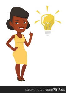 An african-american student pointing his finger up at the idea bulb. Excited student with bright idea bulb. Student having a great idea. Vector flat design illustration isolated on white background.. Student pointing at light bulb vector illustration