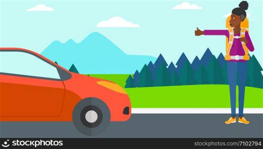 An african-american woman hitchhiking trying to stop a car on the background of mountains and trees vector flat design illustration. Horizontal layout.. Young woman hitchhiking.