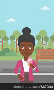 An african-american woman holding a big icecream in hand on a park background vector flat design illustration. Vertical layout.. Woman holding icecream.