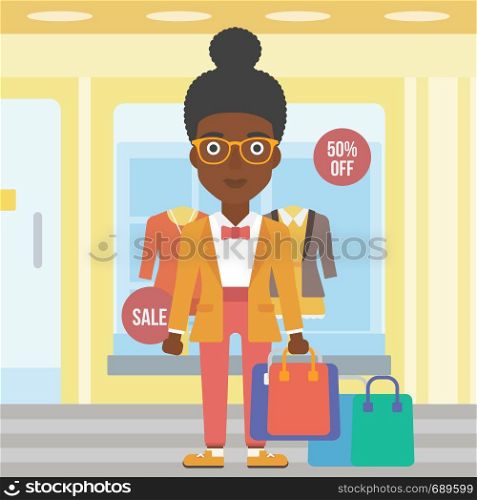 An african-american woman holding shopping bags on the background of boutique window with dressed mannequins. Happy young woman carrying shopping bags. Vector flat design illustration. Square layout.. Happy woman with bags vector illustration.
