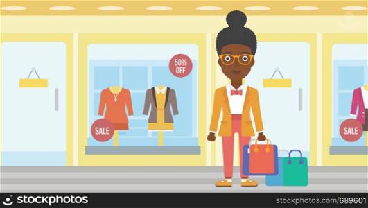An african-american woman holding shopping bags on the background of boutique window with dressed mannequins. Happy woman carrying shopping bags. Vector flat design illustration. Horizontal layout.. Happy woman with bags vector illustration.