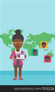 An african-american woman holding tablet computer with social network user profile on a screen on a background of map with avatars of social network. Vector flat design illustration. Vertical layout.. Woman holding tablet with social network.