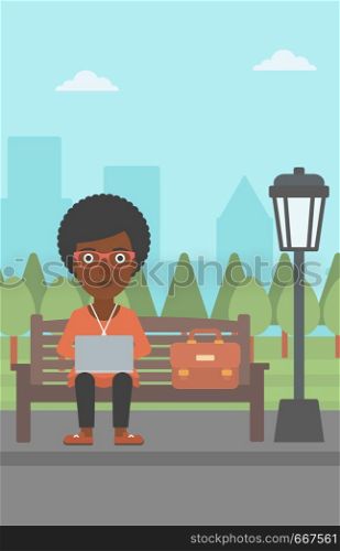 An african-american woman sitting in the park on a bench and working on a laptop vector flat design illustration. Vertical layout.. Woman working on laptop.