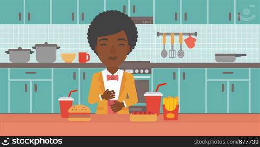 An african-american woman standing in the kitchen in front of table full of junk food and suffering from heartburn vector flat design illustration. Horizontal layout.. Woman suffering from heartburn.