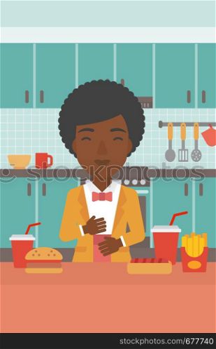 An african-american woman standing in the kitchen in front of table full of junk food and suffering from heartburn vector flat design illustration. Vertical layout.. Woman suffering from heartburn.